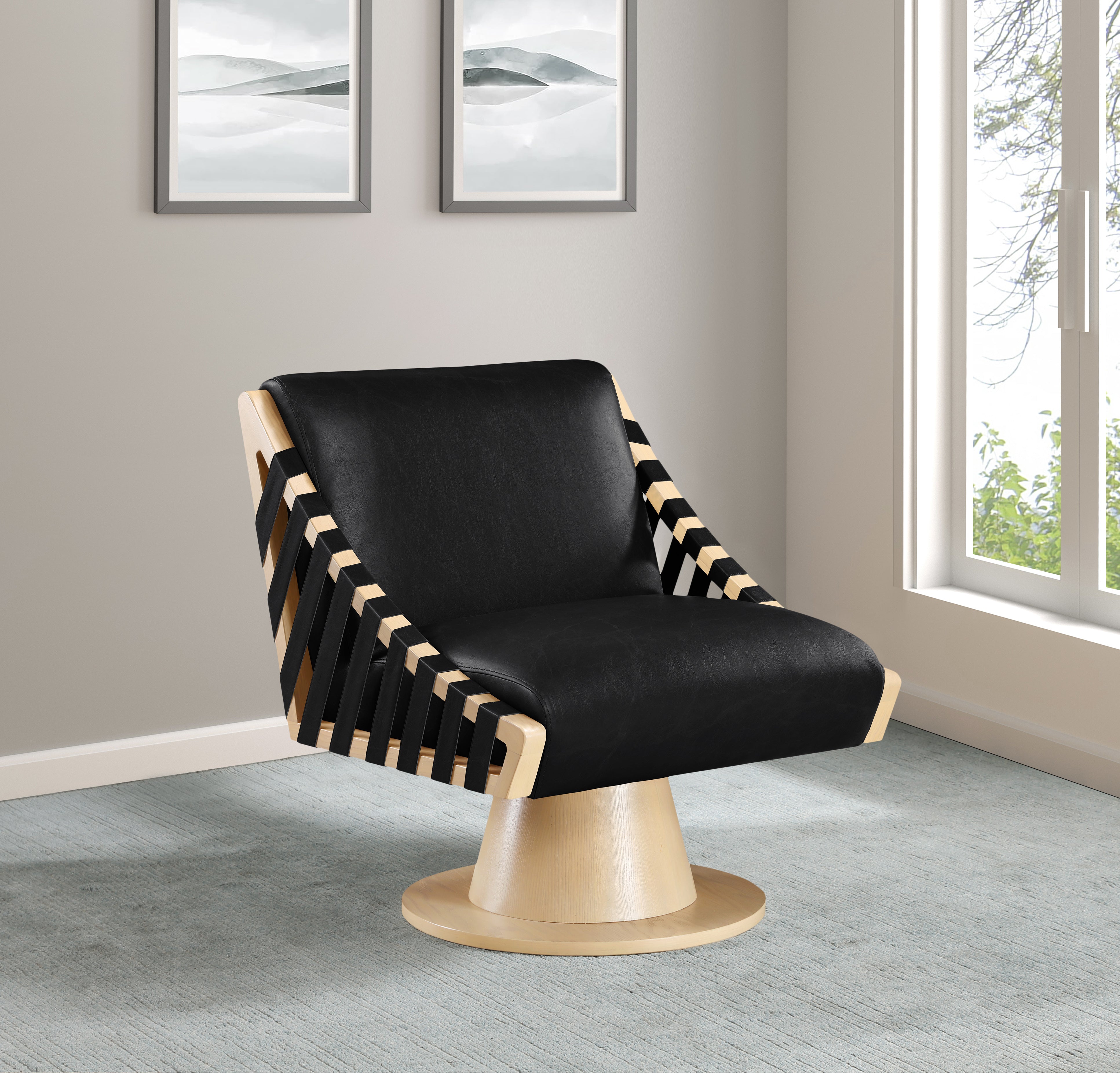 Modern black chair with wooden accents in a room with light gray walls and a window.