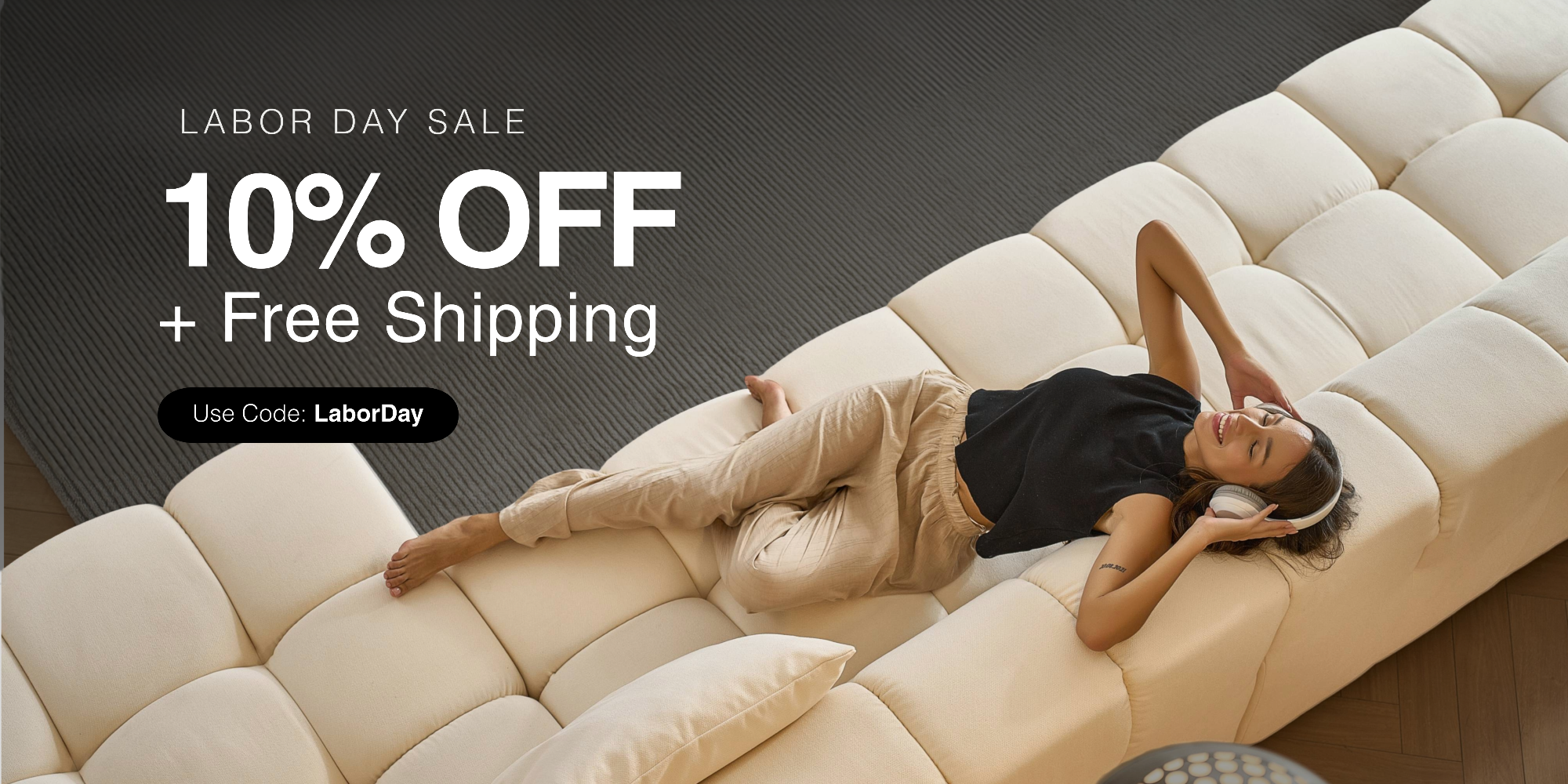 Woman lying on a beige quilted foam sofa sectional with a Mario Capasa Labor Day sale text overlay
