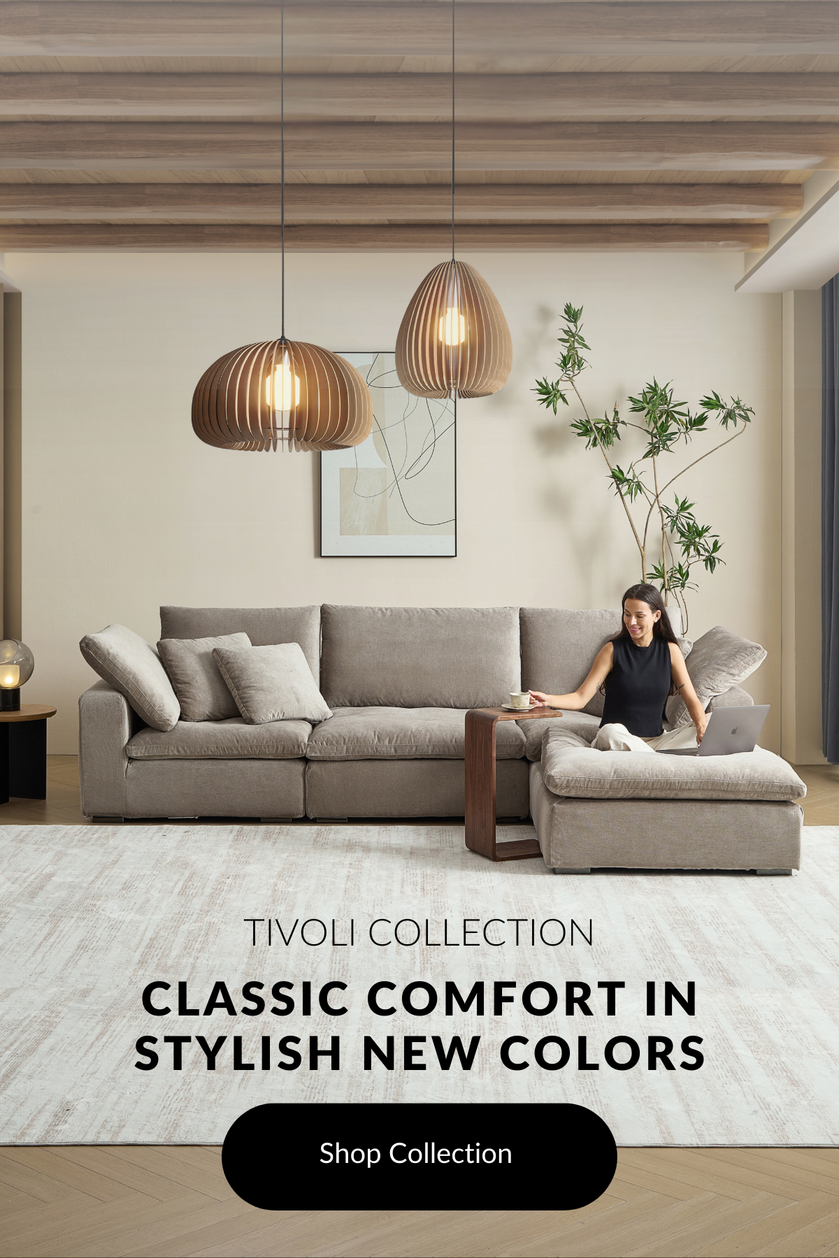 Gray cloud couch dupe in a modern room facing right. A woman is sitting on the ottoman as she reaches for her coffee sitting on her wood side table.