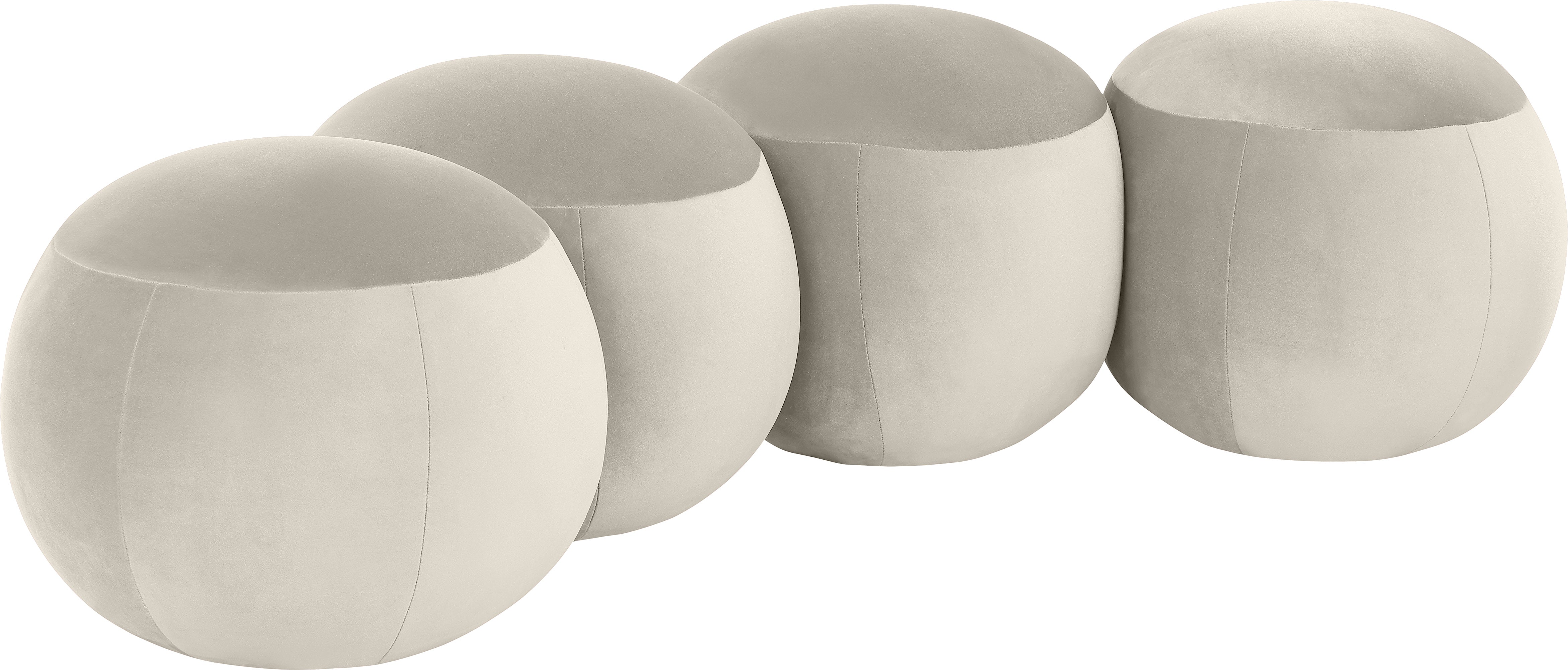 Set of four round beige stools with a soft texture.