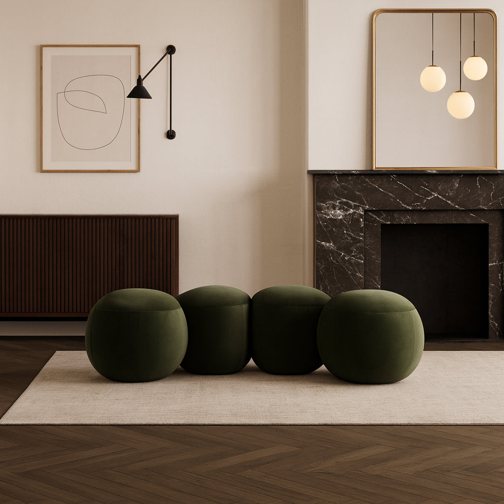 Modern living room with green ottomans, marble fireplace, and abstract art.