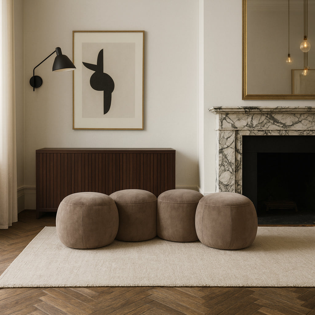 Modern living room with brown ottomans, abstract art, and a fireplace.