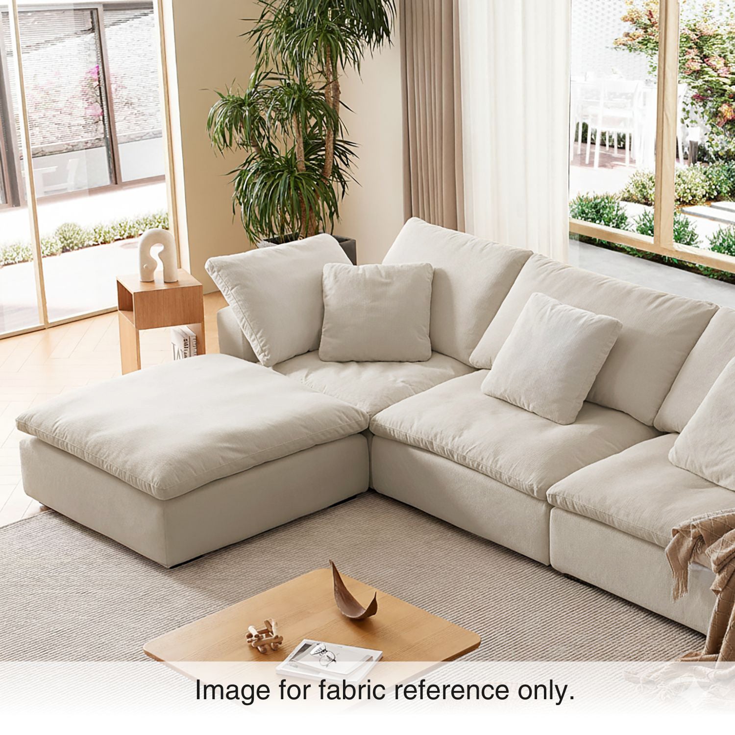 Beige velvet modular sectional sofa in a modern living room with soft natural light, featuring plush upholstery and neutral tones from the Tivoli Collection by Mario Capasa.