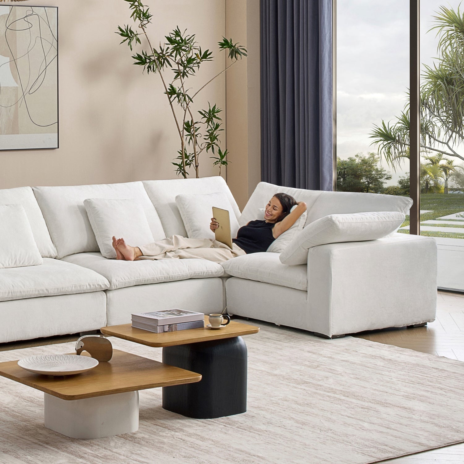 Woman in a minimalist style living room lying down on a Mario Capasa corner cloud sectional