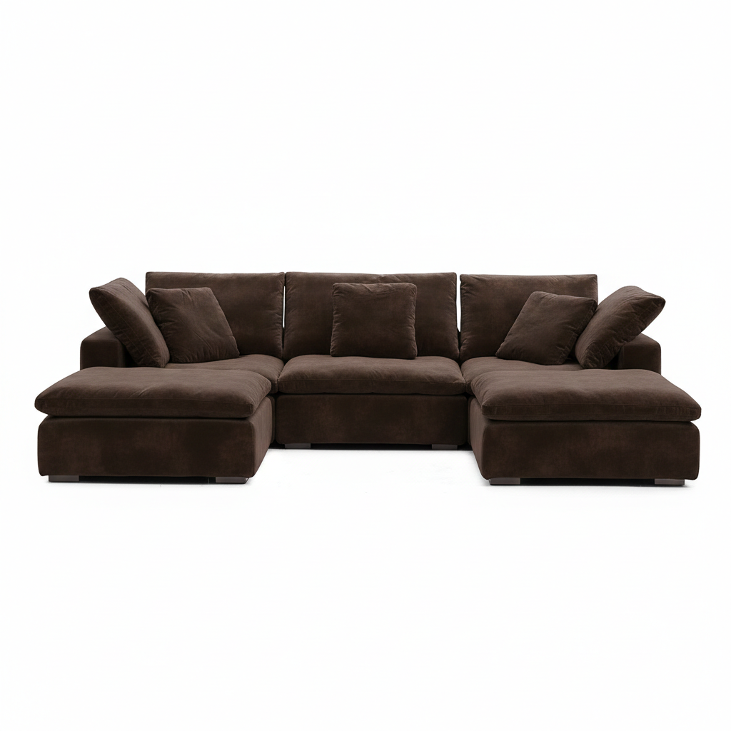 Low-slung chocolate velvet sofa with sculptural lines and refined living room furniture appeal.