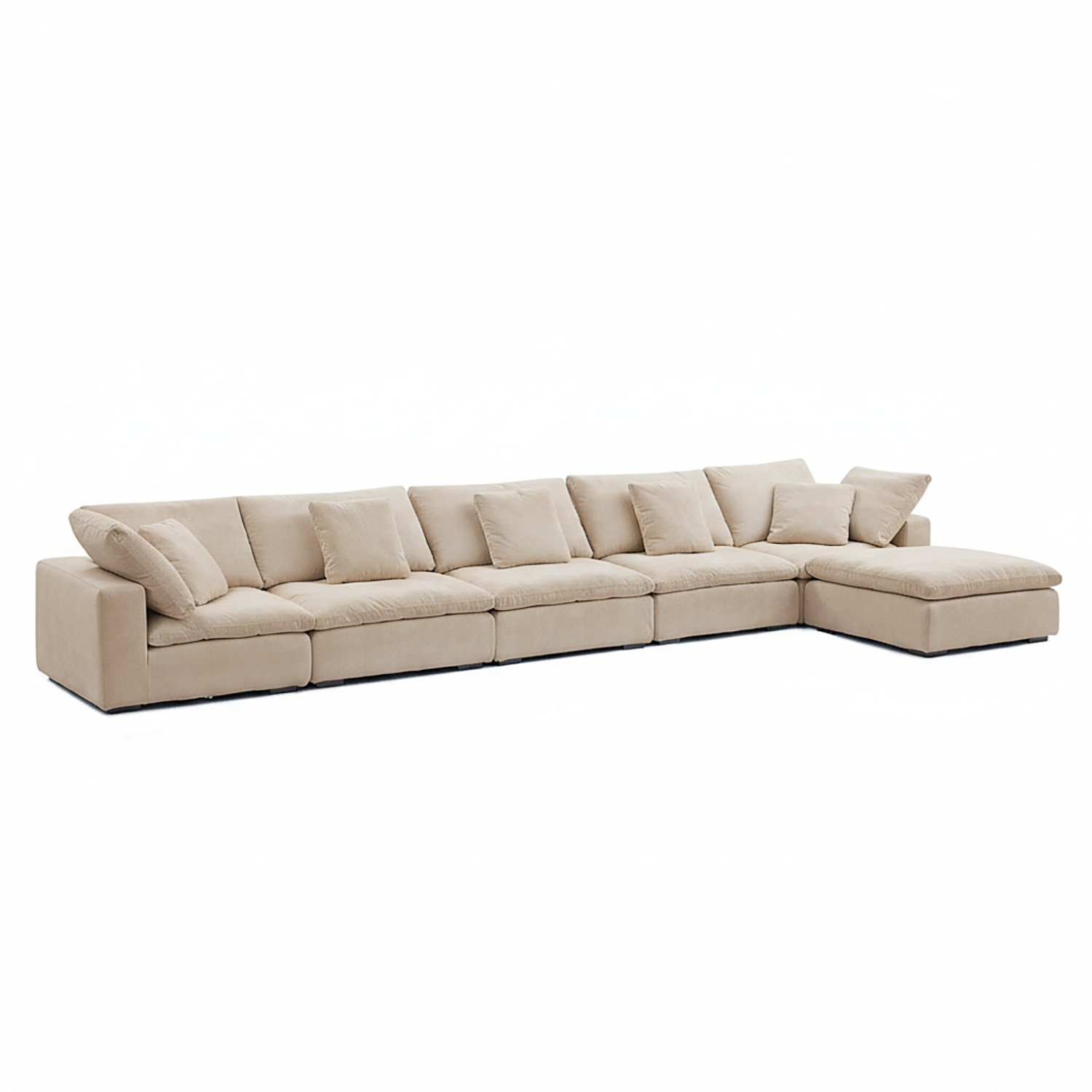 A sectional sofa with chaise by Mario Capasa, upholstered in cream velvet with deep seating and wide arms for contemporary living rooms